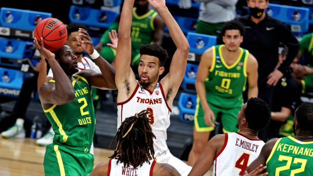 Mar 28, 2021; Indianapolis, Indiana, USA; Oregon Ducks forward Eugene Omoruyi (2) shoots the ball against USC Trojans forward Isaiah Mobley (3) during the second half in the Sweet Sixteen of the 2021 NCAA Tournament at Bankers Life Fieldhouse. Mandatory Credit: Trevor Ruszkowski-USA TODAY Sports